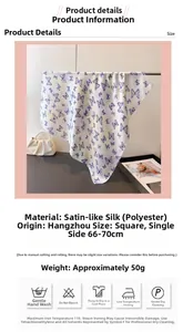 Detail view of white satin scarf with purple butterfly print and care labels