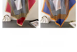 Detail view of geometric silk scarves in red and navy blue patterns with glossy texture