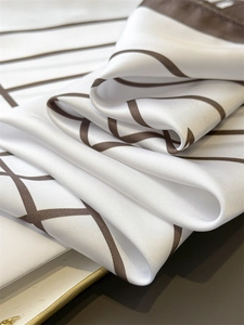 Macro detail of silky satin fabric with minimalist geometric lines and smooth texture
