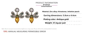 Detailed view of bee earrings featuring colorful rhinestones and pearls measuring 5.0x4.4cm
