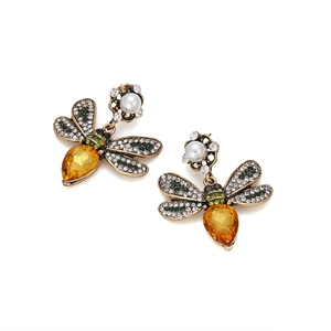 Retro bee drop earrings with yellow teardrop gems and pearls on a white background