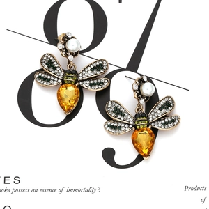 Vintage gold bee drop earrings with crystal wings, pearl accents, and yellow drop stone