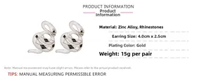 Detailed view of snake earrings with white enamel and diamond accents 4.0cm x 2.5cm size