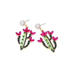 Exaggerated cactus earrings with colorful crystals and pearl studs on white background