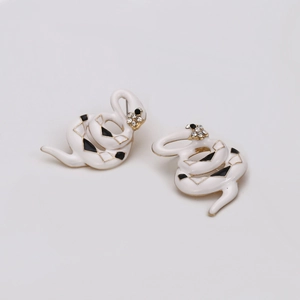 Minimalist snake hoop earrings with black and white enamel and gold metal finish