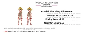 Detailed view of oversized skeleton drop earrings with pink and yellow rhinestones