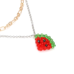 Handmade beaded watermelon pendant necklace with dual-tone metal chain in a layered design