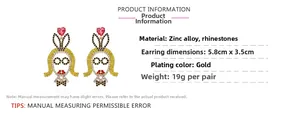 Detail view of cartoon girl drop earrings with pink hearts and sparkling rhinestones