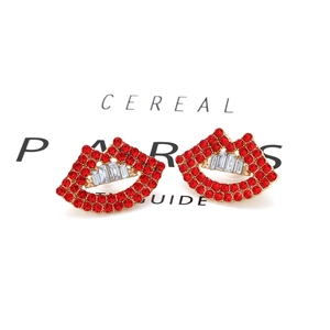 Creative red rhinestone lip-shaped earrings with gold alloy base on a white background