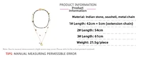 Detailed specs of bohemian triple-layered necklace with conch and stone charms