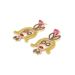 Cartoon girl earrings with yellow rhinestones and a pink heart crystal accent