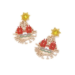 Chunky gold earrings with colorful crystals and sun-shaped stud in a hollow hollow design