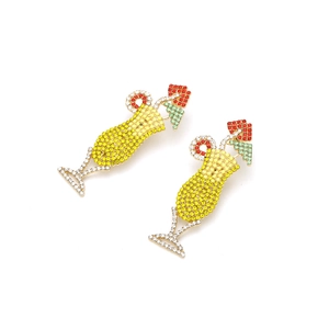 Close-up of cocktail glass earrings with colorful rhinestones and gold-plated alloy