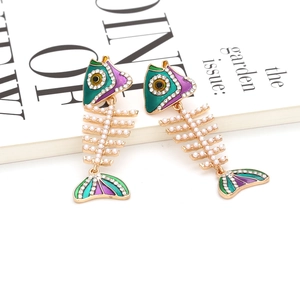 Exaggerated fishbone drop earrings with pearls and colorful enamel on a white background