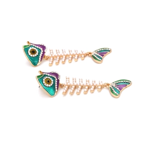 Exaggerated fishbone earrings with pearls, green enamel, and rhinestones in gold finish