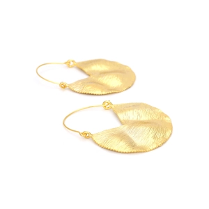 Detailed macro view showing the textured golden surface and ripples of these alloy earrings