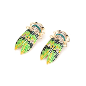 Macro shot of cicada earrings with green drip oil wings and sparkling crystal details