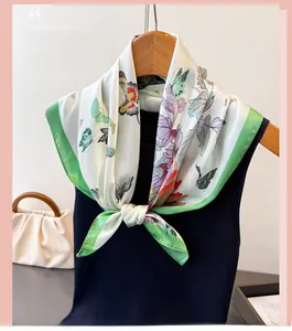 Detailed butterfly print on elegant ivory silk scarf with green borders and floral accents