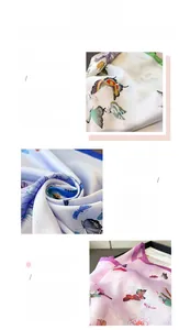 Detailed view of butterfly print silk scarf showing fabric texture and rolled hem edges