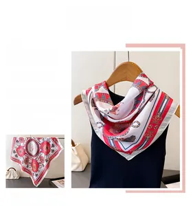 Detail view of European equestrian print silk scarf with chain and medal patterns