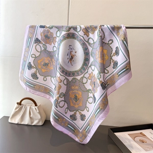 Detailed pattern of a European palace style silk scarf with horse and medal prints