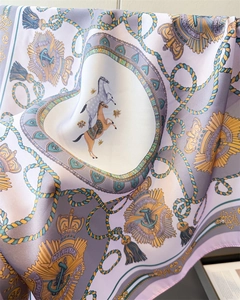 Detailed close-up of luxurious silk satin scarf featuring vintage European royal horse prints