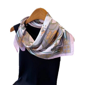 Elegant European horse print silk scarf in lavender and grey on a wooden hanger