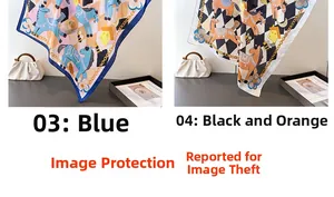 Detail of silk-like square scarves in blue and orange horse print with elegant patterns