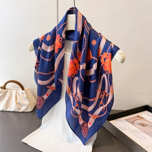 Navy blue silk-like square scarf with retro chain print and orange floral design