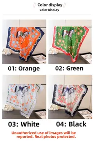 Detail of silk-feel square scarves featuring horse print in orange green white and black
