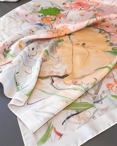 Detail of oil painting style silk scarf with soft satin luster and fine rolled edges