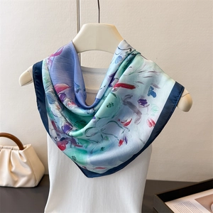 Detail of silk-like square scarf featuring abstract floral oil painting print and hand-rolled edge