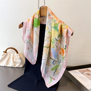 Elegant oil painting floral silk scarf with vibrant pink and yellow blossoms on a hanger