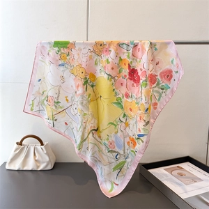 Detail view of abstract oil painting floral print on large silk scarf with pink hemmed edges