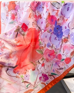 Close-up of oil painting style floral print on high-quality satin silk scarf fabric