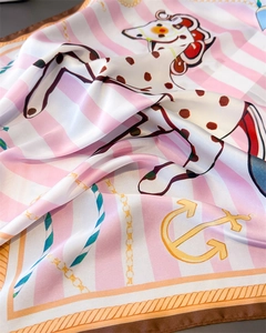 Detailed view of silk square scarf featuring nautical anchors and dalmatian prints