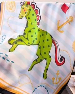 Detail of silk square scarf featuring nautical anchors and green horse prints