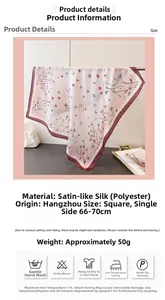 Detailed view of square silk-like scarf with floral print and deep red rolled edges
