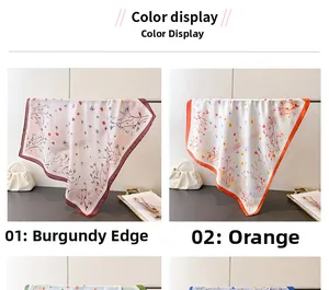 Detailed color display of silk-feel scarves with floral prints in burgundy and orange