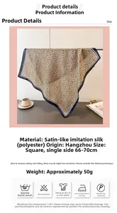 Detail view of leopard print silk scarf measuring 70cm with polished satin finish