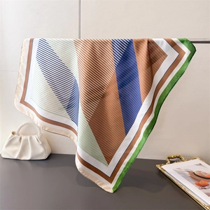 Detailed pattern view of geometric silk-like satin square scarf with diagonal stripes