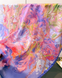 Detail of artistic oil painting floral print silk scarf with violet hem and glossy texture