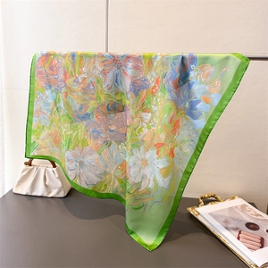 Detail of silk-like floral square scarf with oil painting print and green edges