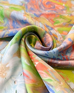 Macro shot of silk scarf fabric with impressionist floral pattern and soft texture