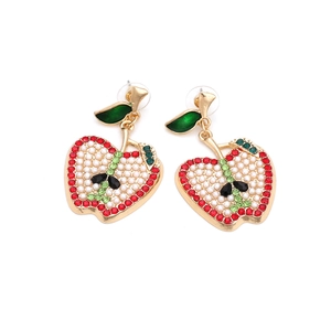 Exaggerated apple earrings with red crystals, white pearls, and gold metal finish