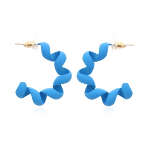 Matte bright blue spiral C-shaped hoop earrings with gold posts on a white background