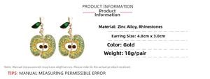 Detail of apple-shaped earrings showing dimensions and green rhinestone pavé settings