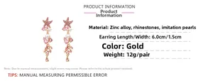 Detail view of gold alloy starfish earrings with pink rhinestones and white pearls