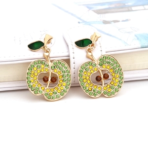 Macro detail of apple drop earrings with colorful rhinestones and green enamel leaf