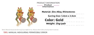 Detailed view of gold-tone frog earrings with colorful rhinestones and size specifications